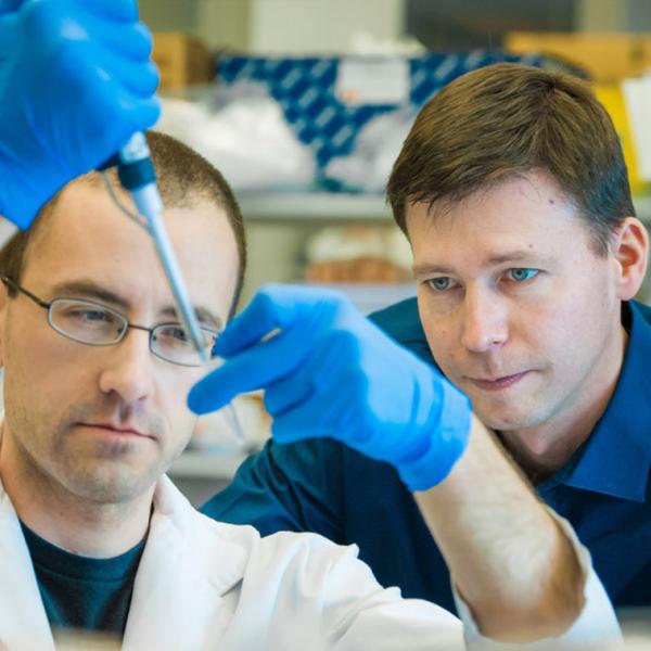 Dr. Tim Kieffer in his lab with a member of his research team